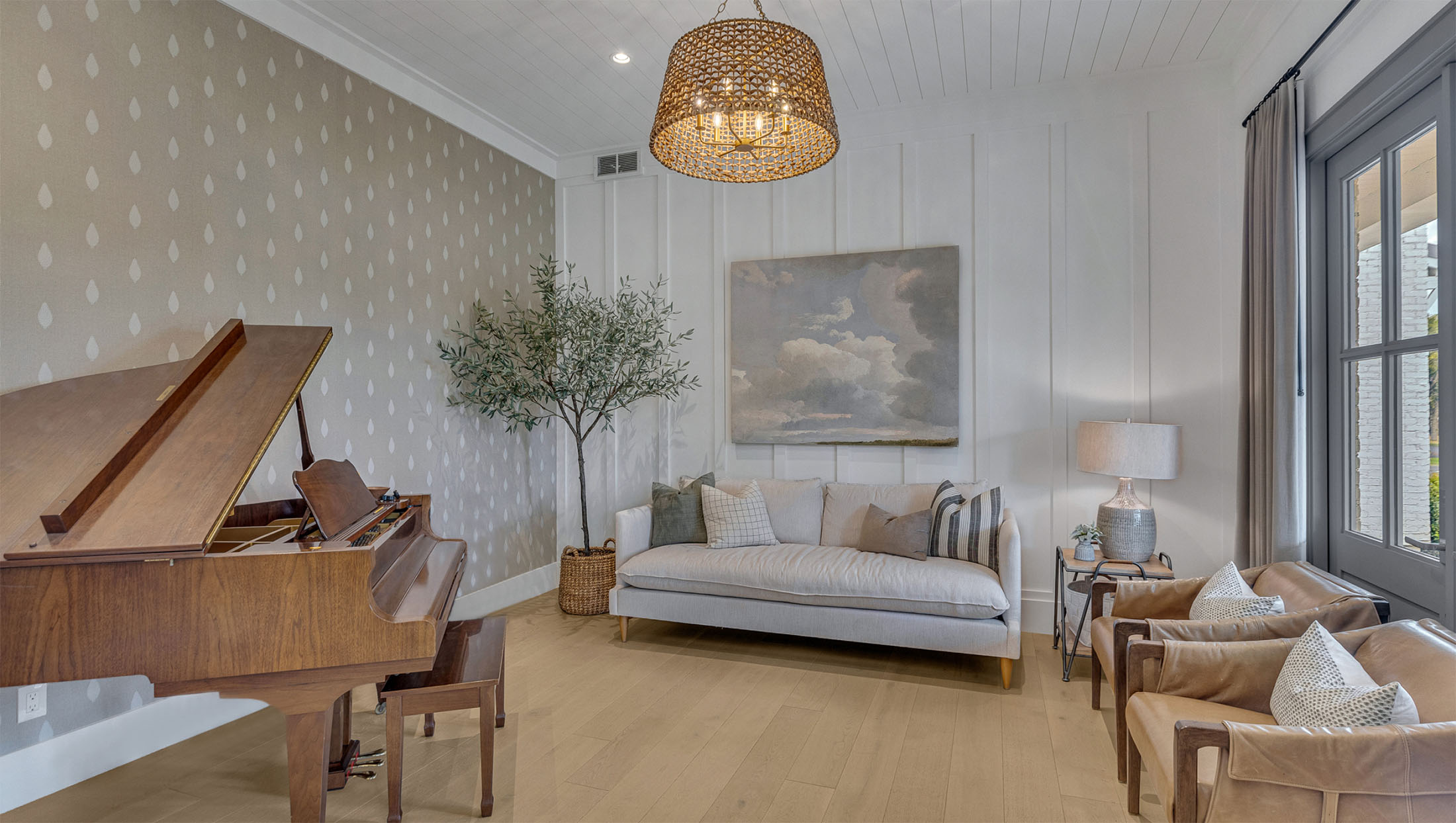 Charming Music Room with Grand Piano – A refined music room with a grand piano, board-and-batten walls, and a woven chandelier, designed to enhance acoustics and ambiance in a luxury home.