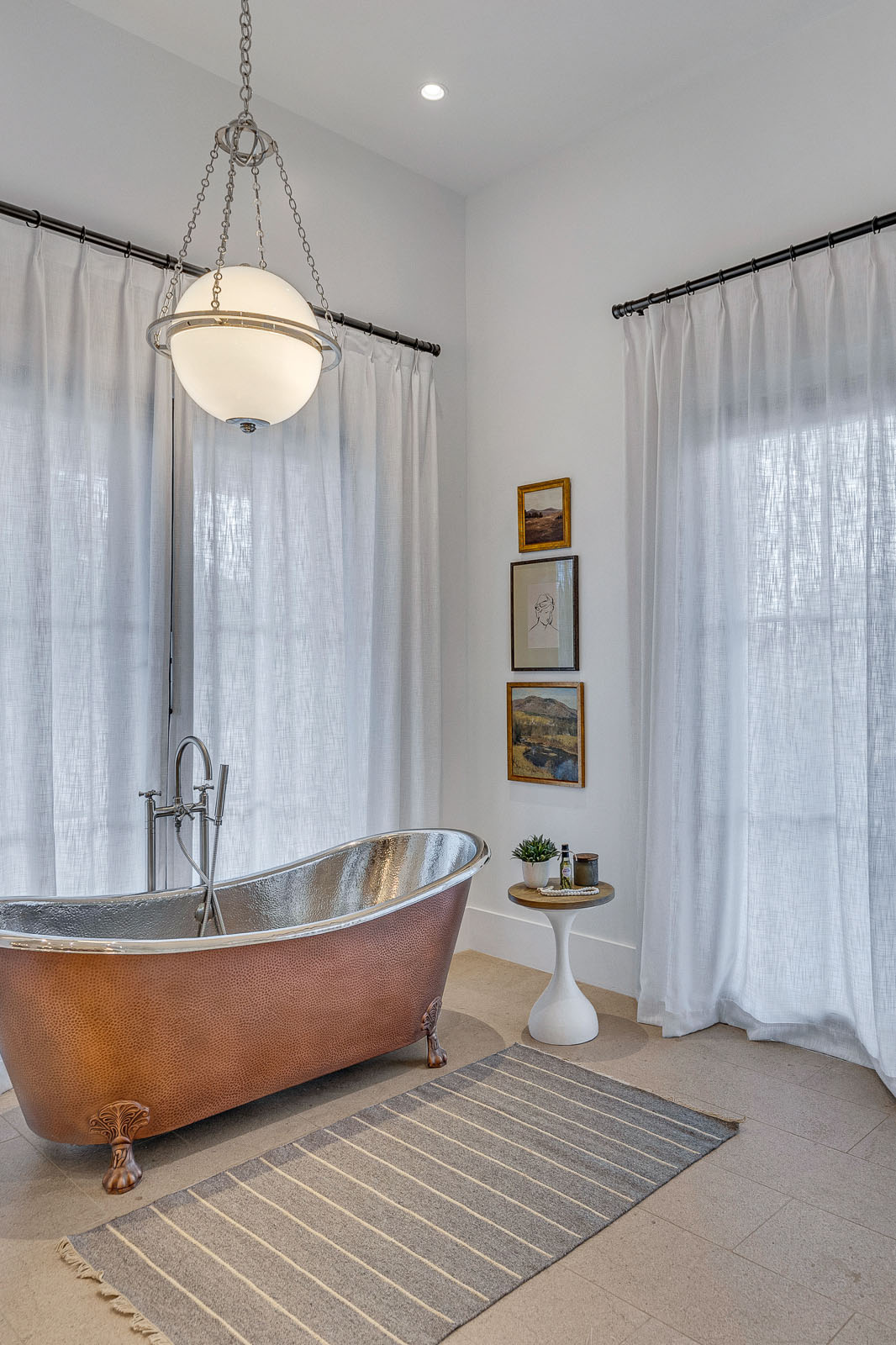 Spa-Inspired Bathroom with Copper Clawfoot Tub – Luxurious bathroom design featuring a vintage-inspired copper clawfoot tub, elegant pendant lighting, and sheer floor-length curtains for a serene and spa-like experience.